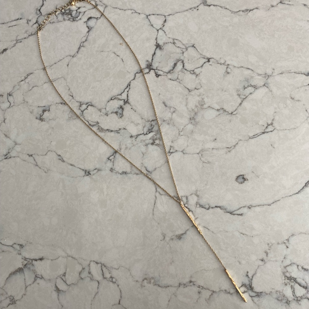 Gold colored necklace lariat